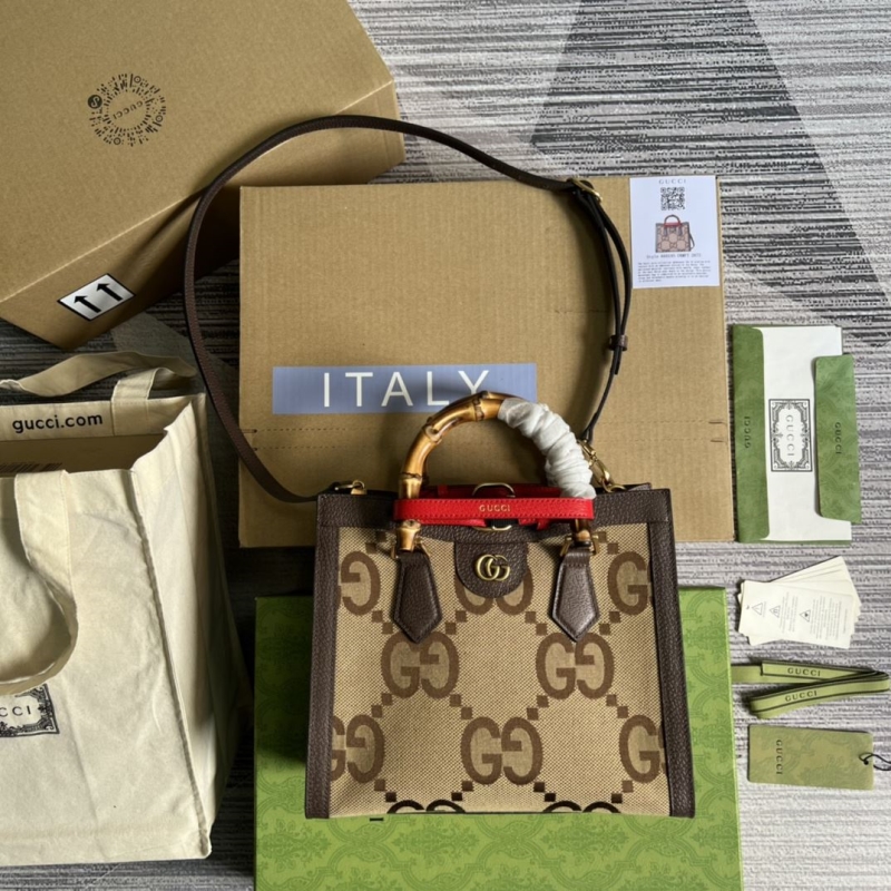 G*u*i top handle bags